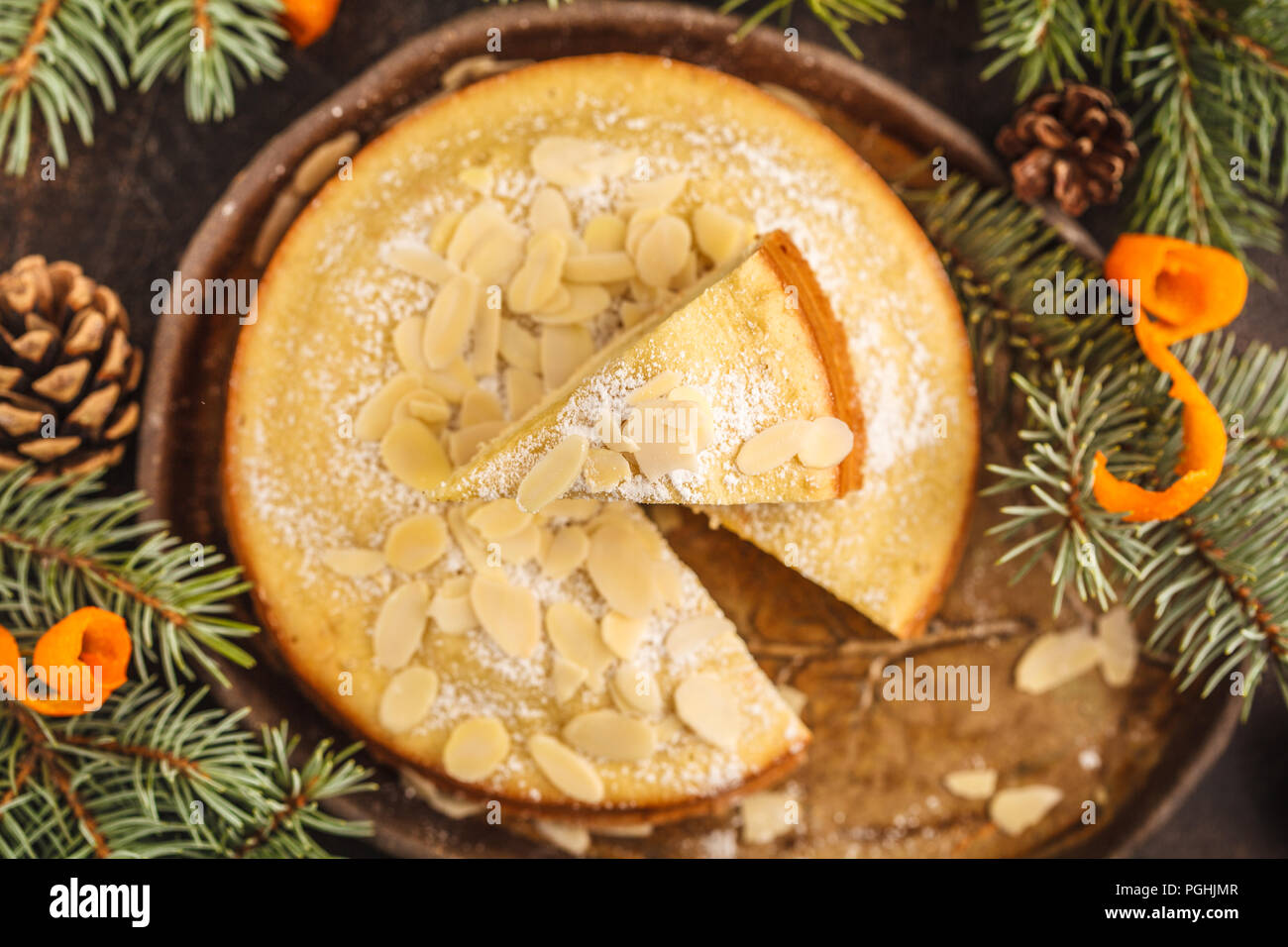https://c8.alamy.com/comp/PGHJMR/traditional-christmas-norwegian-almond-cake-in-christmas-decorations-dark-background-christmas-dessert-concept-PGHJMR.jpg