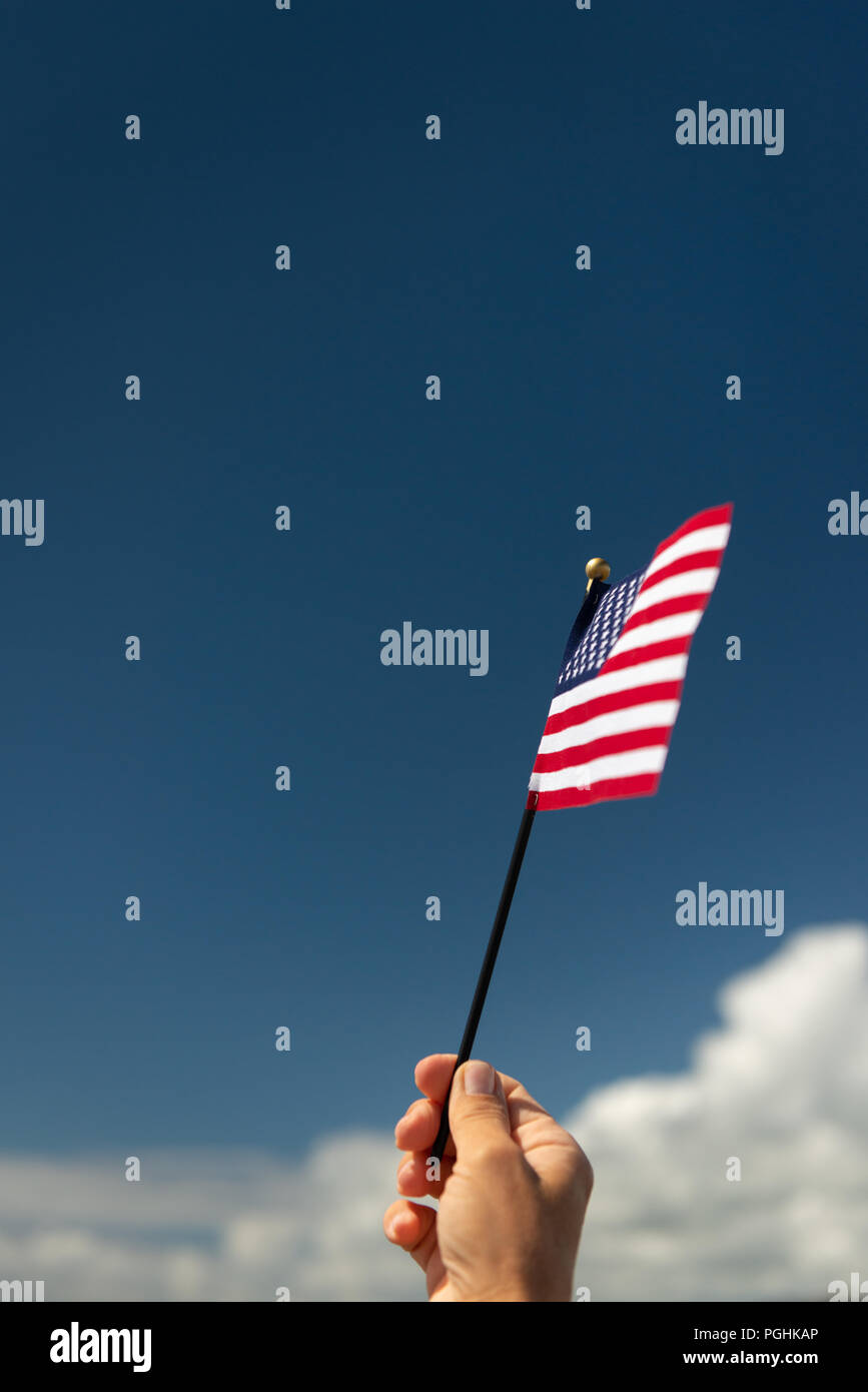 American flag against blue sky. Stock Photo
