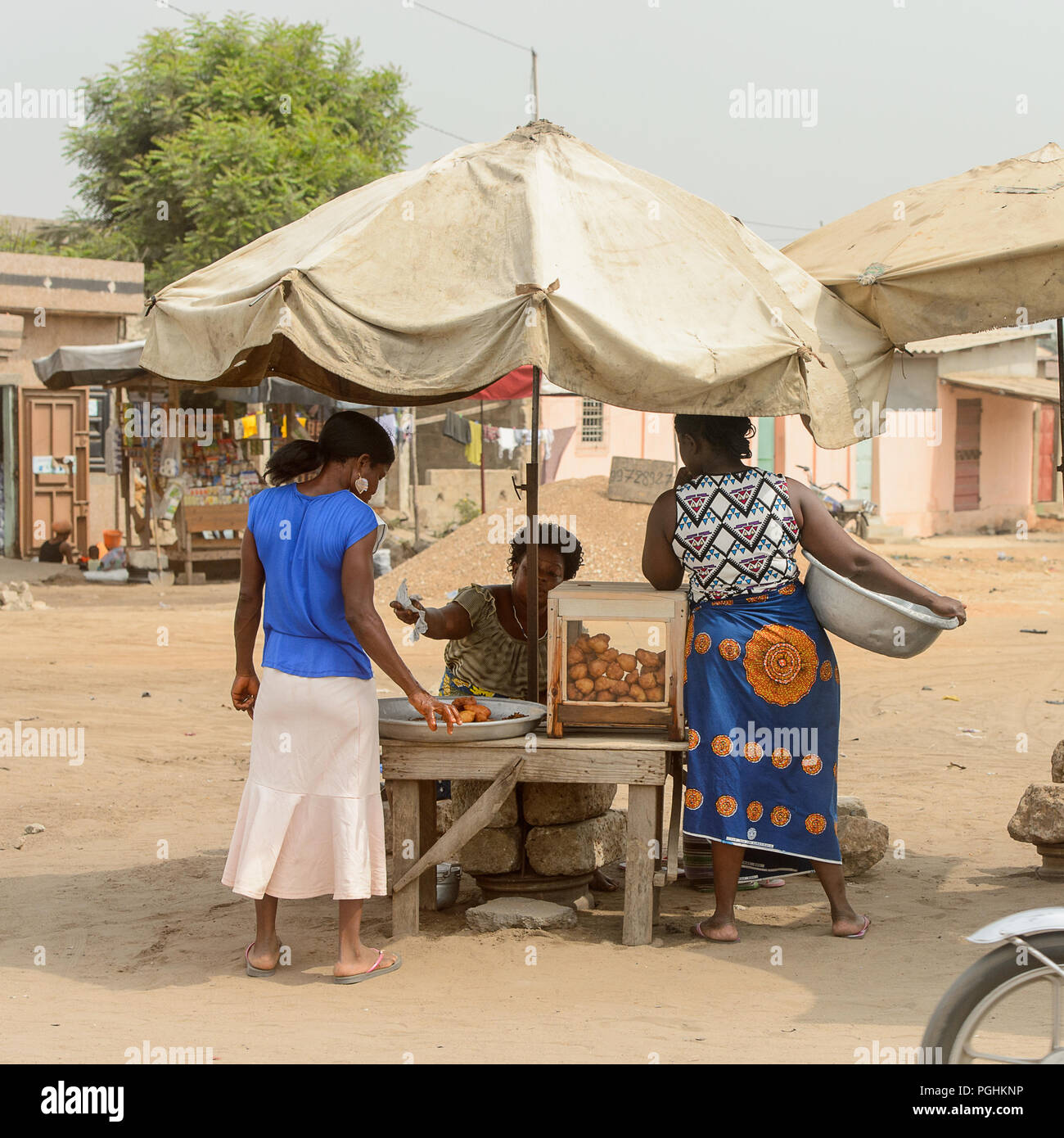 LOME, TOGO Jan 9, 2017 Unidentified Togolese woman sells food under