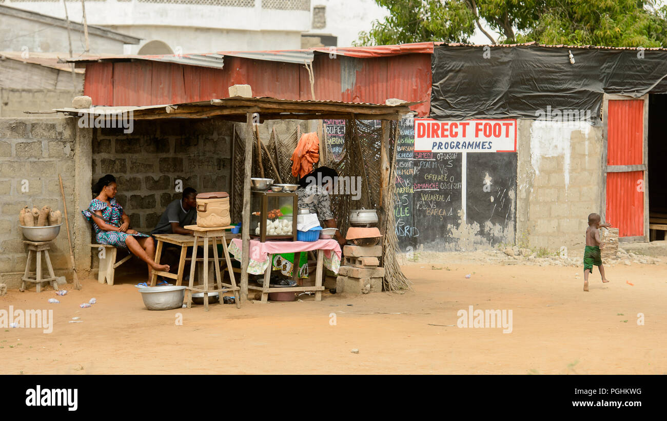 LOME, TOGO Jan 9, 2017 Unidentified Togolese woman sells food behind