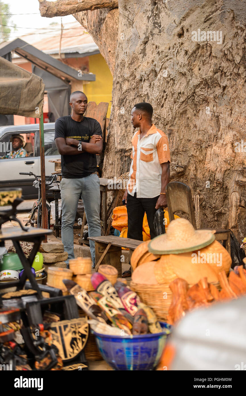 OUIDAH, BENIN - Jan 10, 2017: Unidentified Beninese two men stand near