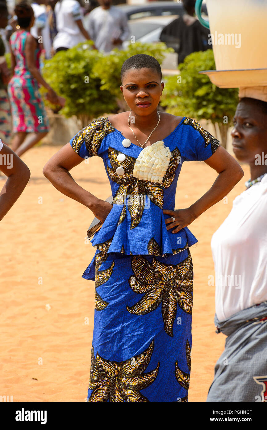 OUIDAH, BENIN - Jan 10, 2017: Unidentified Beninese woman in blue dress  puts her hands on her hips at the voodoo festival, which is anually  celebrated Stock Photo - Alamy