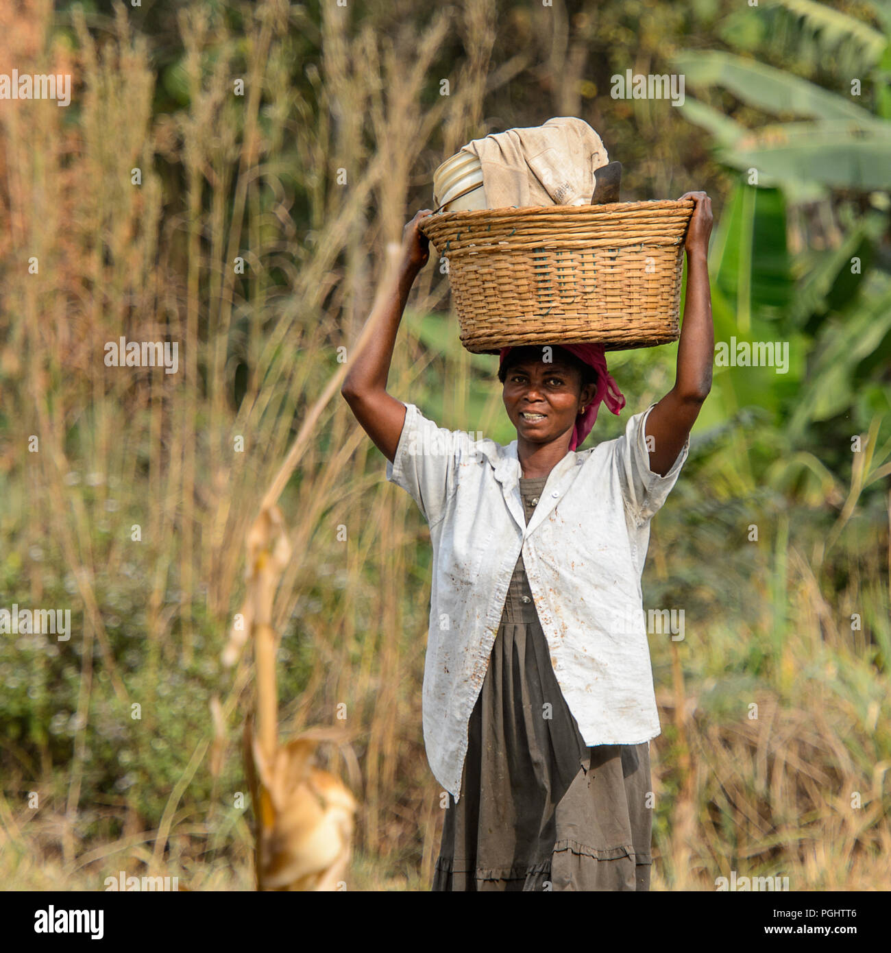 Kumasi Ghana Jan 16 2017 Unidentified Ghanaian Woman Carries A Basket On Her Head Along The