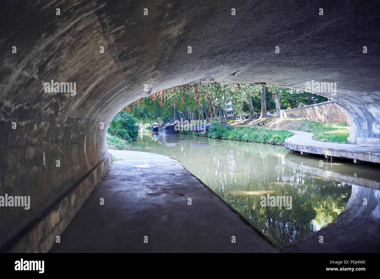 Tunnel over the river Stock Photo Alamy