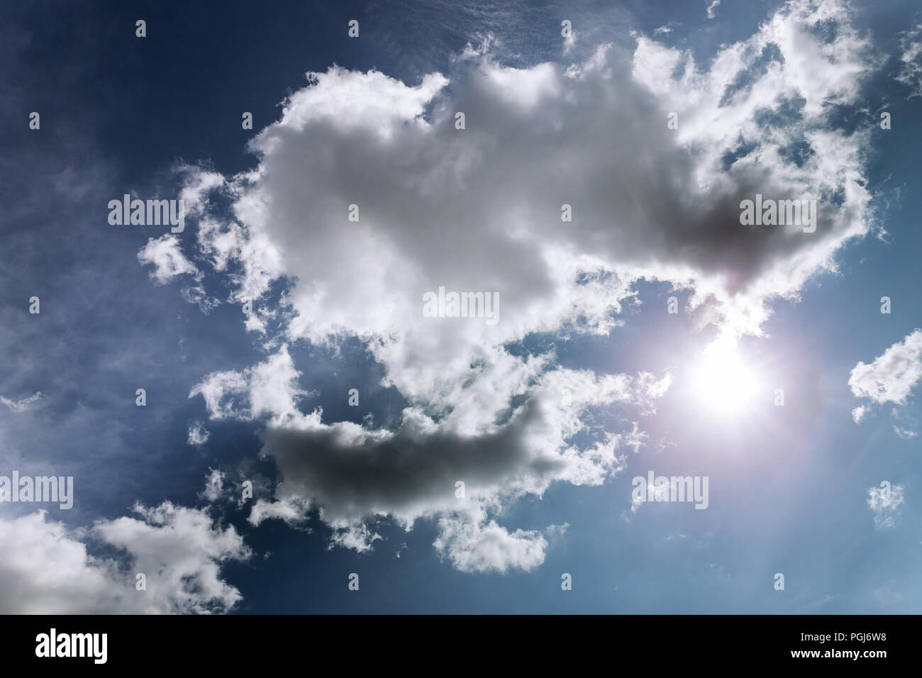 Cloudscape blue sky background with white clouds Stock Photo - Alamy