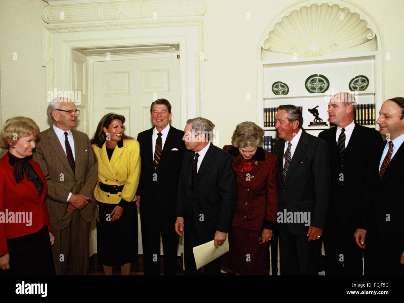 Washington, DC 1984/12/01 President Ronald Reagan meets with members of the  Alzheimer’s foundation in the Oval Office  Photo by Dennis Brack Stock Photo