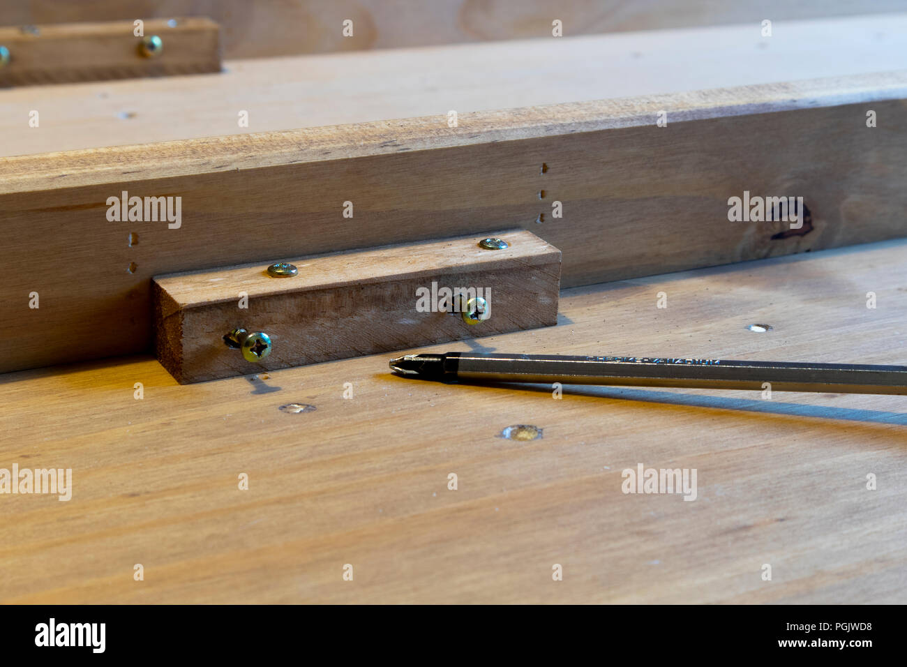 Self assembly bookcase pine flat pack furniture being assembled Stock