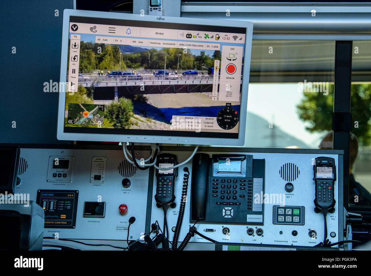 Germany, Freilassing. 27th Aug, 2018. On a monitor in a police car you can see a live image of a Bavarian police drone showing the border control station Saalbrücke from the air. In a press conference at the border control station, Bavarian Interior Minister Herrmann and Federal Interior Minister Seehofer took stock of the Bavarian police's independent border controls Credit: Matthias Balk/dpa/Alamy Live News Stock Photo