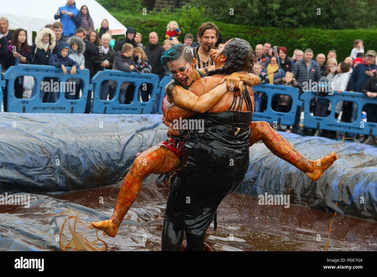 Stacksteads, Bacup, Lancashire, UK. 27 August 2018.The  World Gravy Wrestling Championships at the Rose ‘n Bowl, Stacksteads to raise funds for the East Lancashire Hospice and competitors nominated charities.     A wild and whacky wrestling competition in a 16,000 litre pool full of Lancashire Gravy! All our contestants get sponsorship and really give it their all to raise Credit: Phil Taylor/Alamy Live News Stock Photo