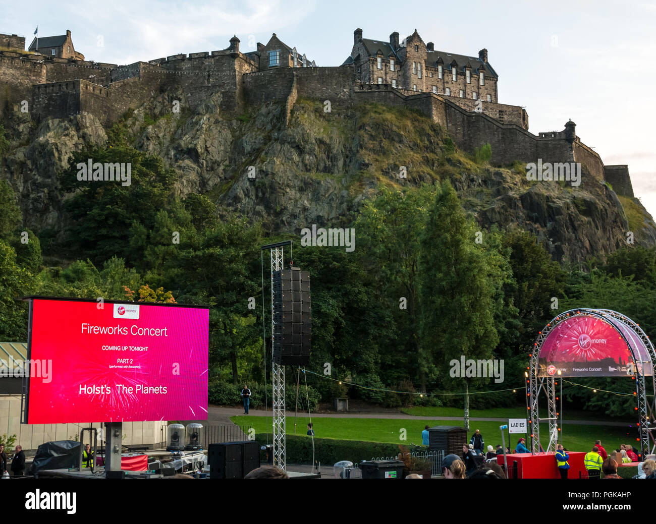 Princes Street Gardens, Edinburgh, Scotland, UK, 27th August 2018. Edinburgh International Festival finale Virgin Money sponsored fireworks. The Scottish Chamber Orchestra play selections from Holst's Suite The Planets choreographed with fireworks from Edinburgh Castle to end the Summer festival. The audience begins to arrive at the Ross bandstand Stock Photo