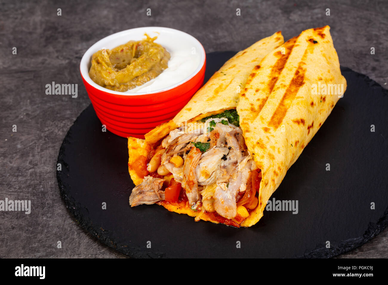 Burrito with meat and sauce Stock Photo - Alamy