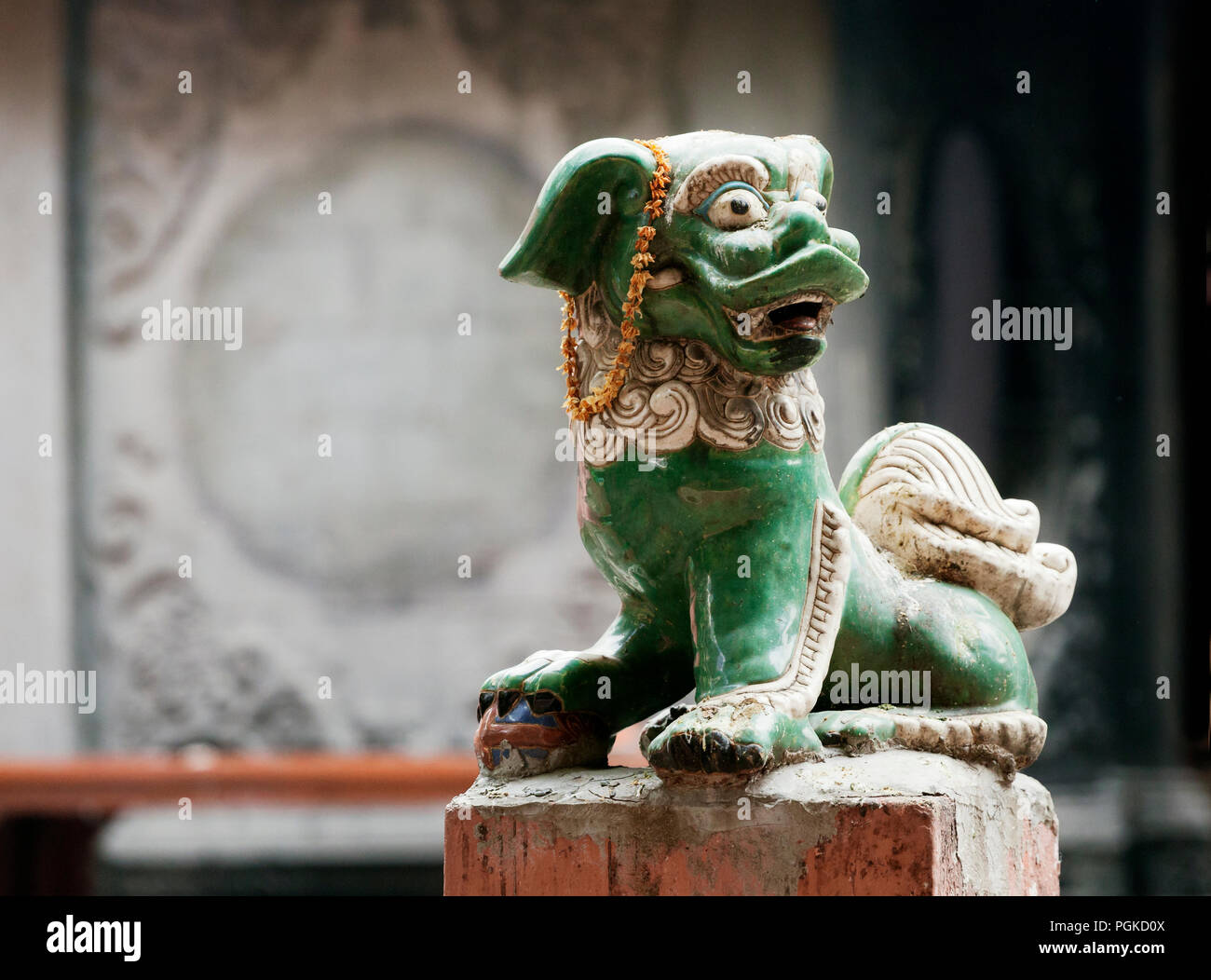 Chinese lion at the entrance of a temple Stock Photo