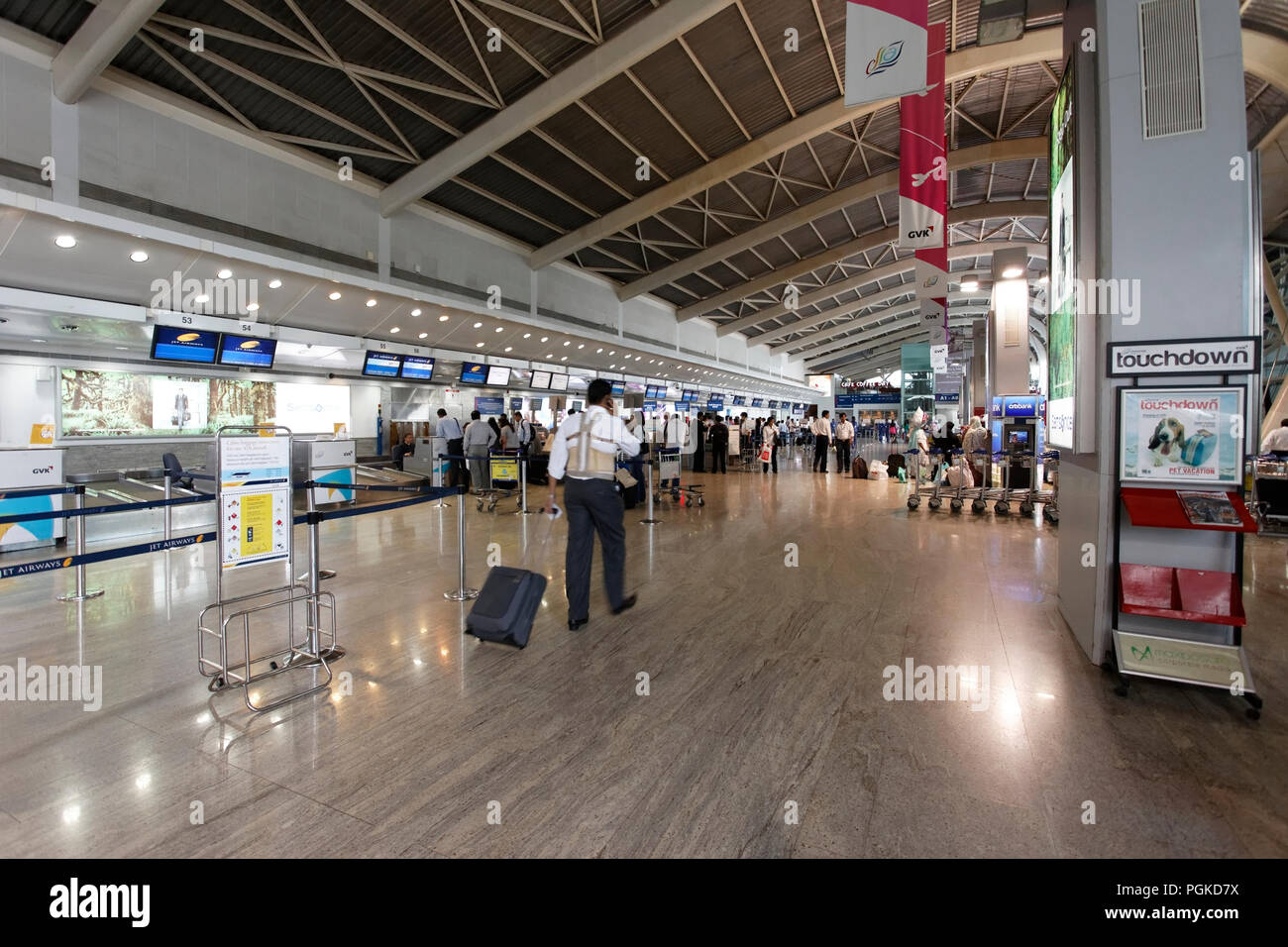 View of new Domestic airport terminal with commuters Mumbai India View of new Domestic airport terminal with commuters Mumbai India
