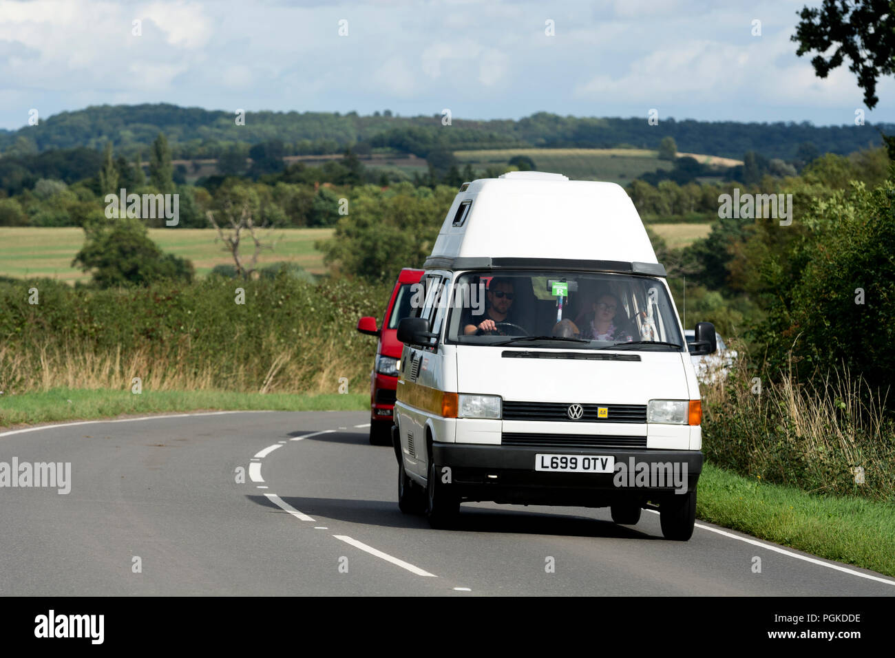 VW campervan on a country road, Warwickshire, UK Stock Photo