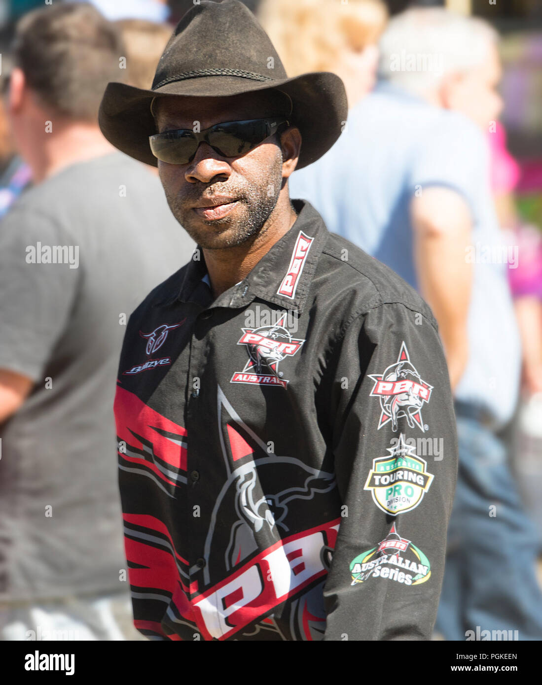 Portrait of a young Aboriginal man wearing a black cowboy hat and sunglasses, Far North Queensland, FNQ, QLD, Australia Stock Photo