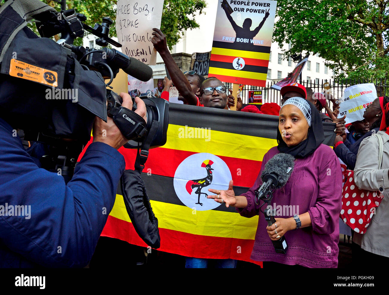 Zuhuru Yanus (BBC Presenter/Producer/Reporter, Swahili TV + World Service) presenting from a protest in Whitehall in support of Bobi Wine (Nigerian po Stock Photo