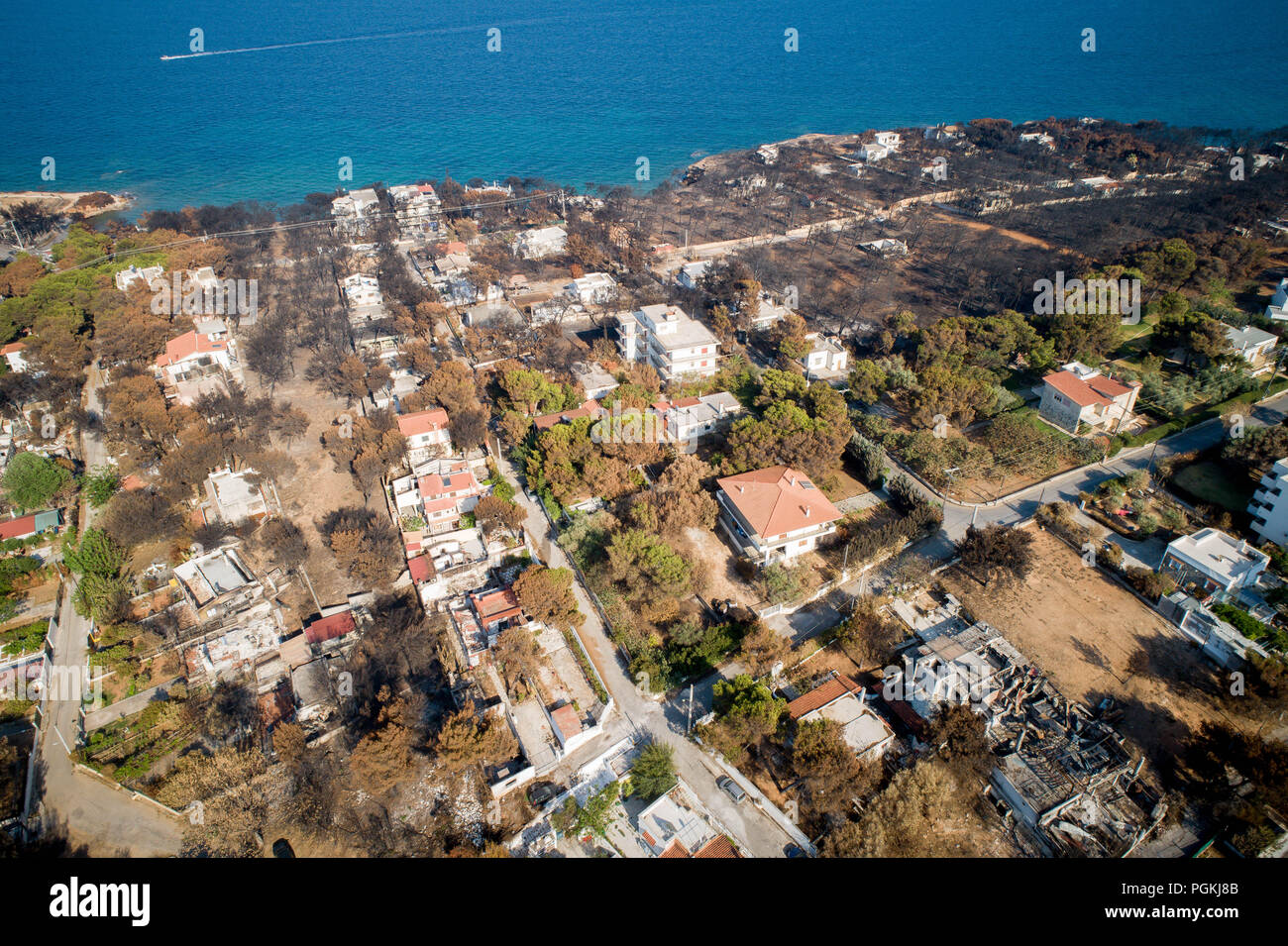 Mati, Athens - July 26, 2018: Aerial view shows a burnt area following a wildfire in the village of Mati, near Athens. Wildfires occurred on the 23 of Stock Photo