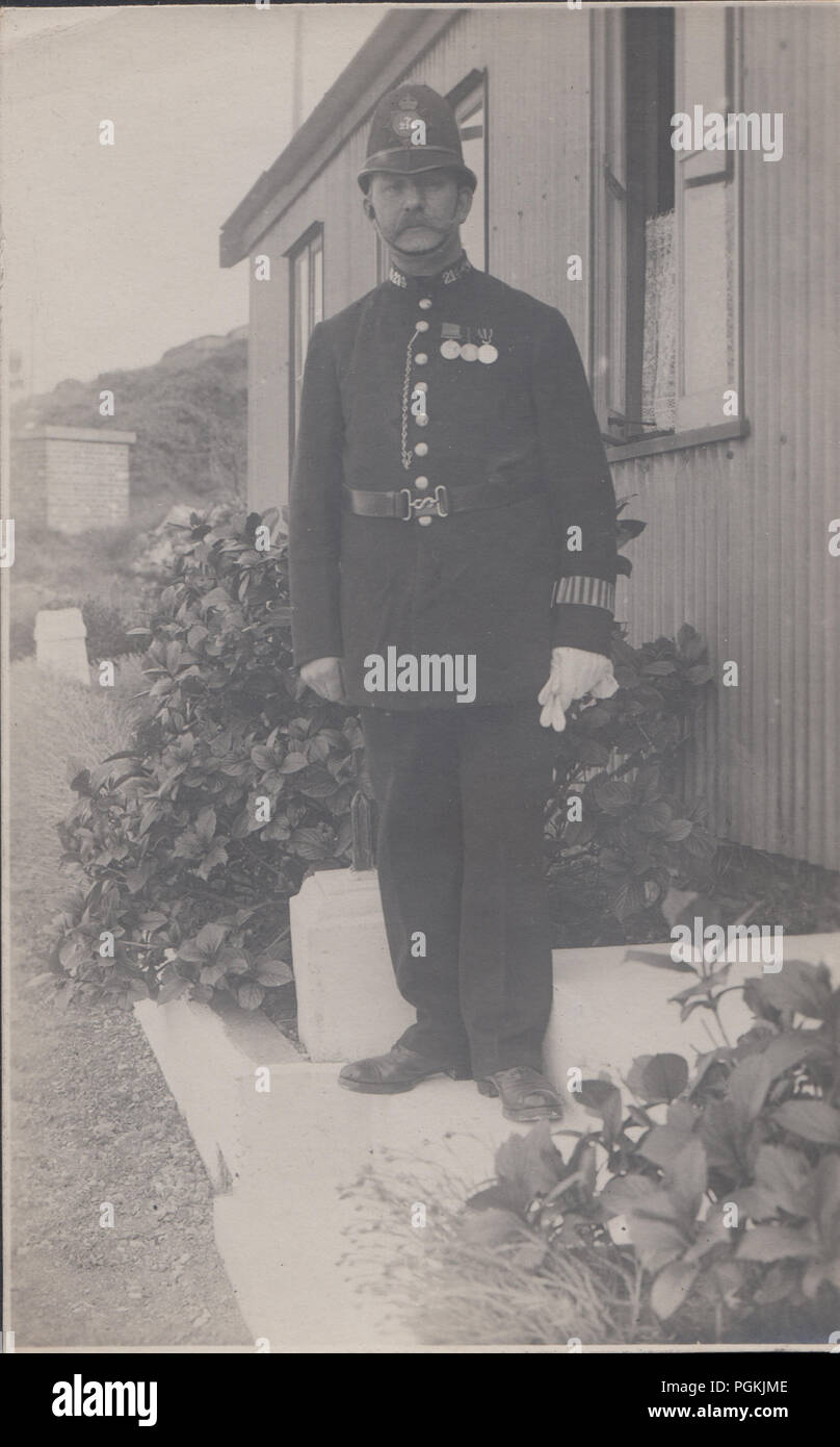 Vintage Weymouth, Dorset Photograph of a Police Constable Wearing His Medals. Collar Number 214 Stock Photo