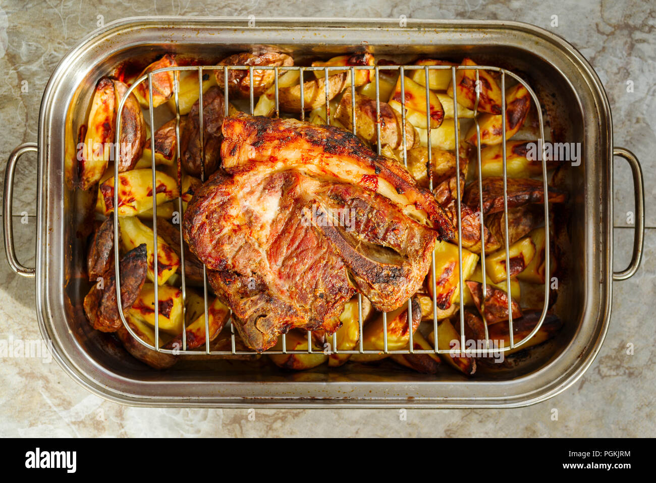 meat with potatoes in the oven Stock Photo Alamy