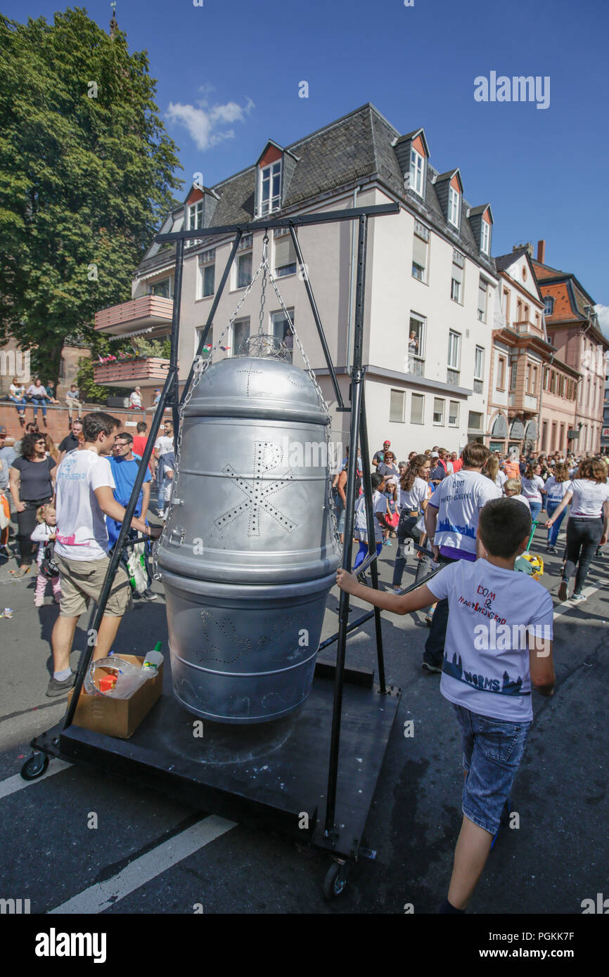 Worms, Germany. 26th Aug, 2018. A man-sized thurible from the Worms Cathedral is carried on a float in the parade. The first highlight of the 2018 Backfischfest was the big parade through the city of Worms with over 70 groups and floats. Community groups, music groups and businesses from Worms and further afield took part. Credit: Michael Debets/Pacific Press/Alamy Live News Stock Photo