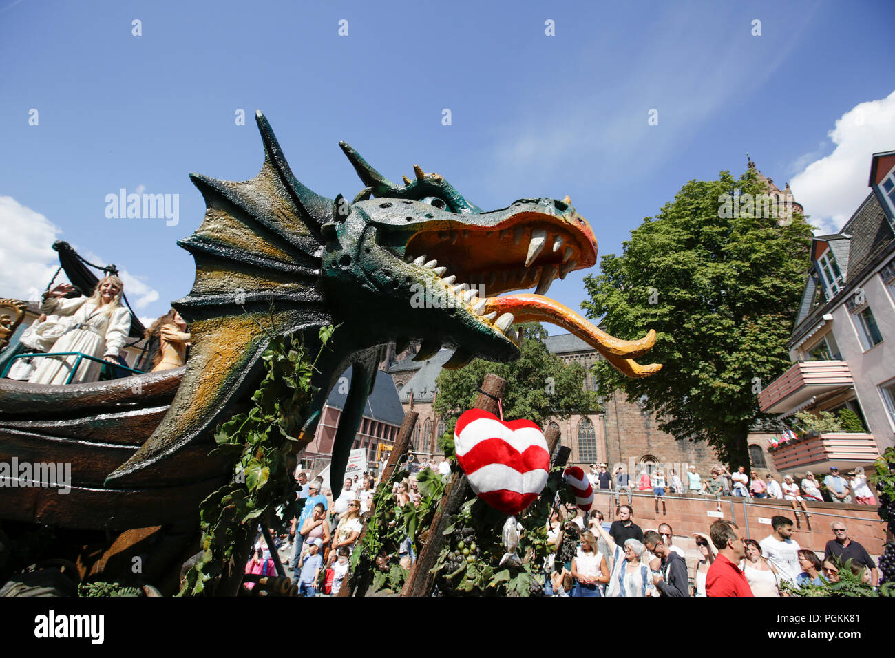 Worms, Germany. 26th Aug, 2018. A dragon's head, the dragon is a symbol for the city of Worms, is pictured on a float. The first highlight of the 2018 Backfischfest was the big parade through the city of Worms with over 70 groups and floats. Community groups, music groups and businesses from Worms and further afield took part. Credit: Michael Debets/Pacific Press/Alamy Live News Stock Photo