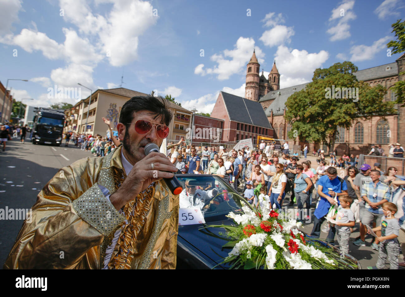 Worms, Germany. 26th Aug, 2018. An Elvis impersonator marches in the parade. The first highlight of the 2018 Backfischfest was the big parade through the city of Worms with over 70 groups and floats. Community groups, music groups and businesses from Worms and further afield took part. Credit: Michael Debets/Pacific Press/Alamy Live News Stock Photo