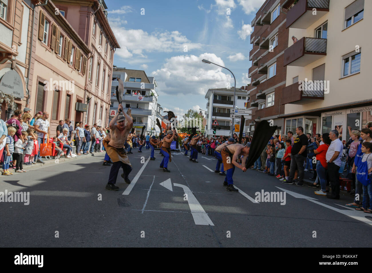 Worms, Germany. 26th Aug, 2018. Local students perform the dance of the leather workers in the parade. The first highlight of the 2018 Backfischfest was the big parade through the city of Worms with over 70 groups and floats. Community groups, music groups and businesses from Worms and further afield took part. Credit: Michael Debets/Pacific Press/Alamy Live News Stock Photo