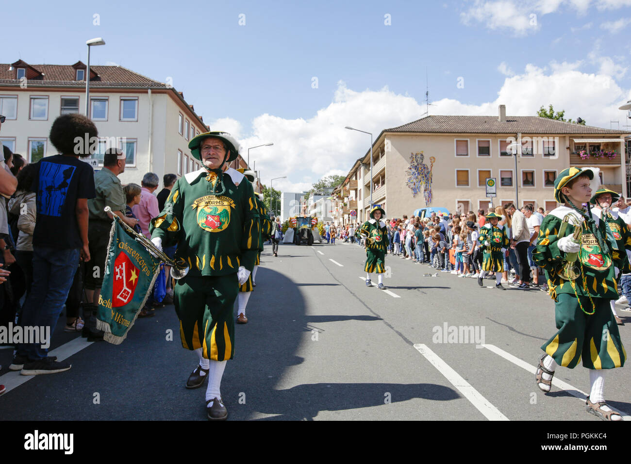 Worms, Germany. 26th Aug, 2018. Members of the Fanfare Corps of the city of Worms march in the parade. The first highlight of the 2018 Backfischfest was the big parade through the city of Worms with over 70 groups and floats. Community groups, music groups and businesses from Worms and further afield took part. Credit: Michael Debets/Pacific Press/Alamy Live News Stock Photo