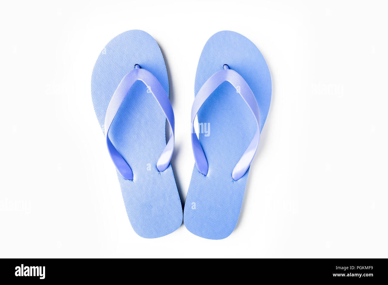 Blue flip flops isolated on white background Stock Photo - Alamy