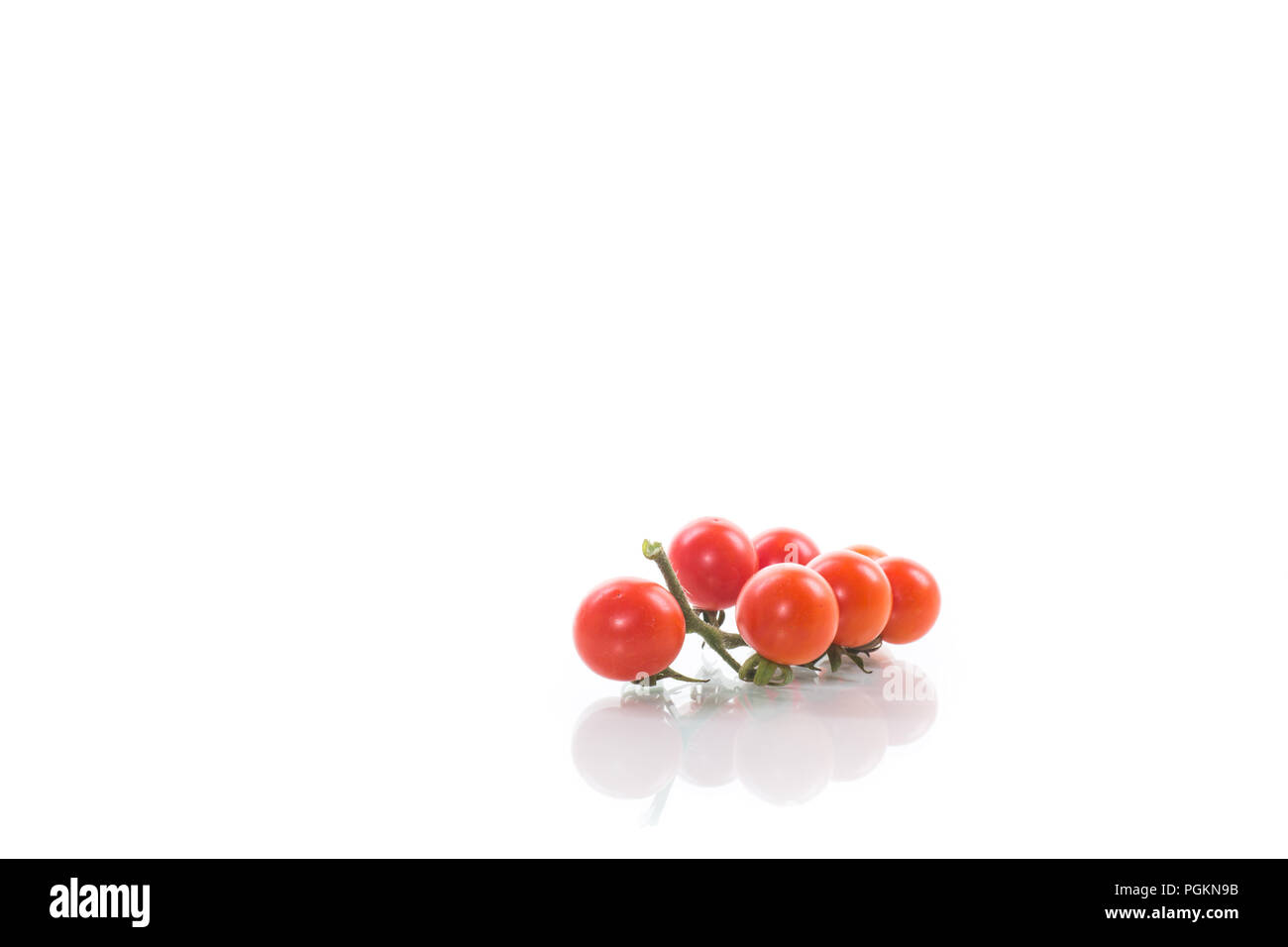 small ripe red cherry tomatoes isolated on white background Stock Photo ...