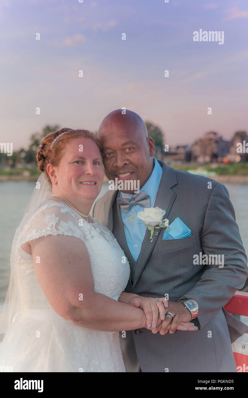 Mixed Race older couple getting married Stock Photo