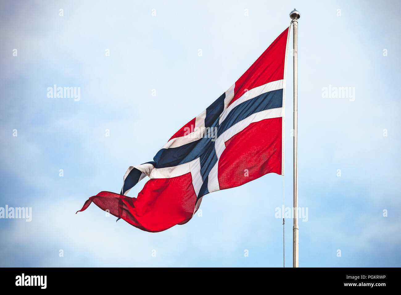 Flag of Norway waving over cloudy sky background Stock Photo - Alamy