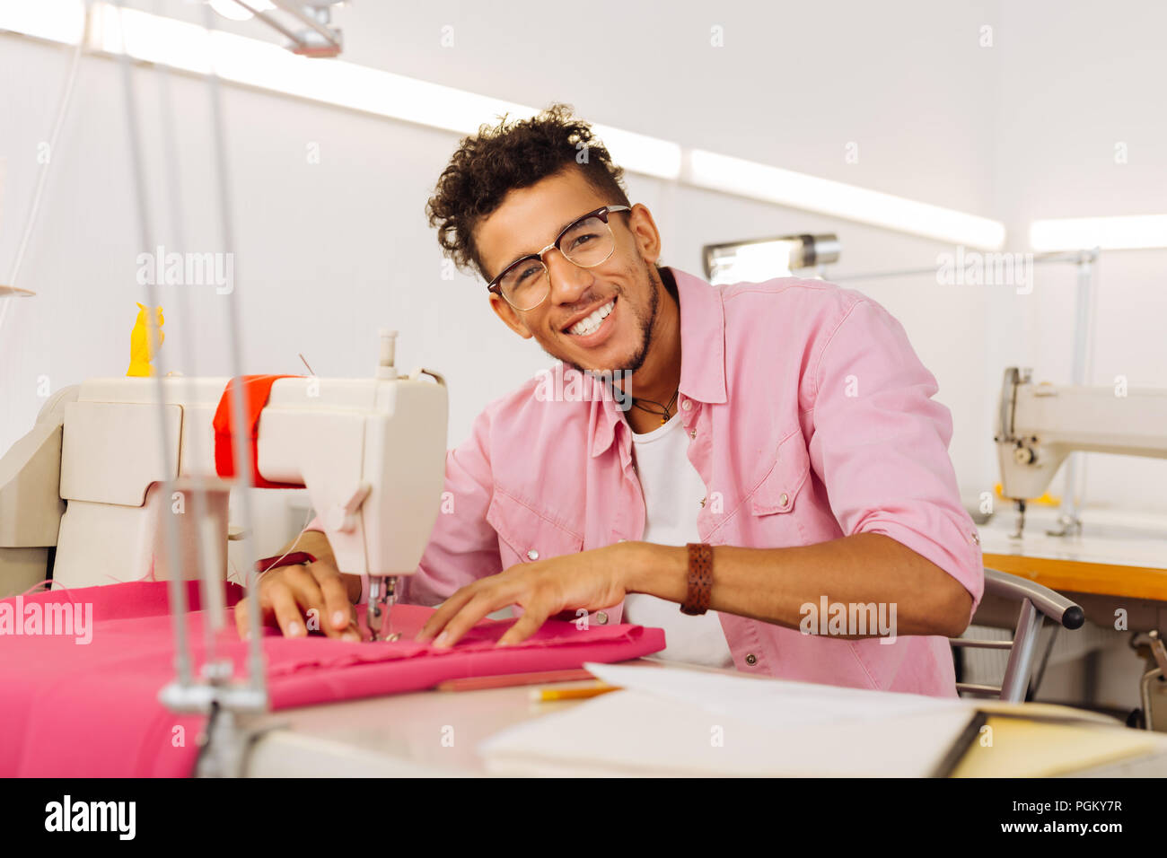Young tailor working textile hi-res stock photography and images - Alamy