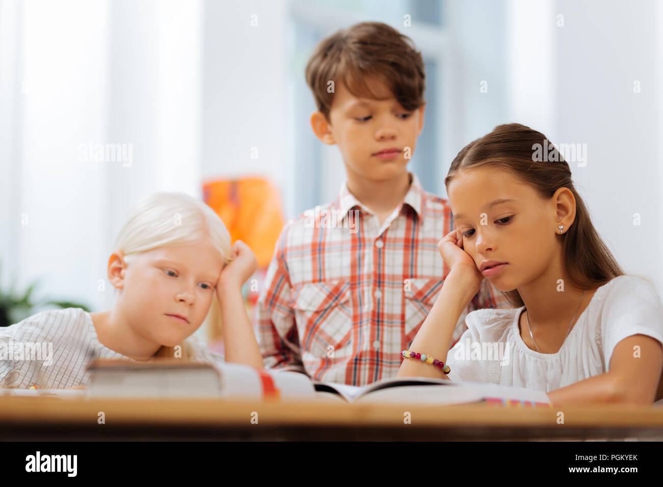 exhausted-tired-kids-reading-a-boring-book-stock-photo-alamy