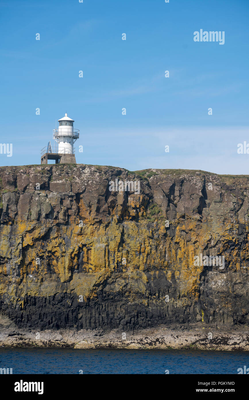 A small lighthouse on the island of Canna.  Canna is the westernmost of the Small Isles archipelago, in the Scottish Inner Hebrides. Stock Photo