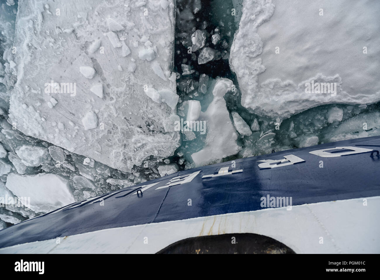 Cruiseship breaking through  sea ice, north of Kvitøya, Arctic Ocean, Svalbard, Norway Stock Photo