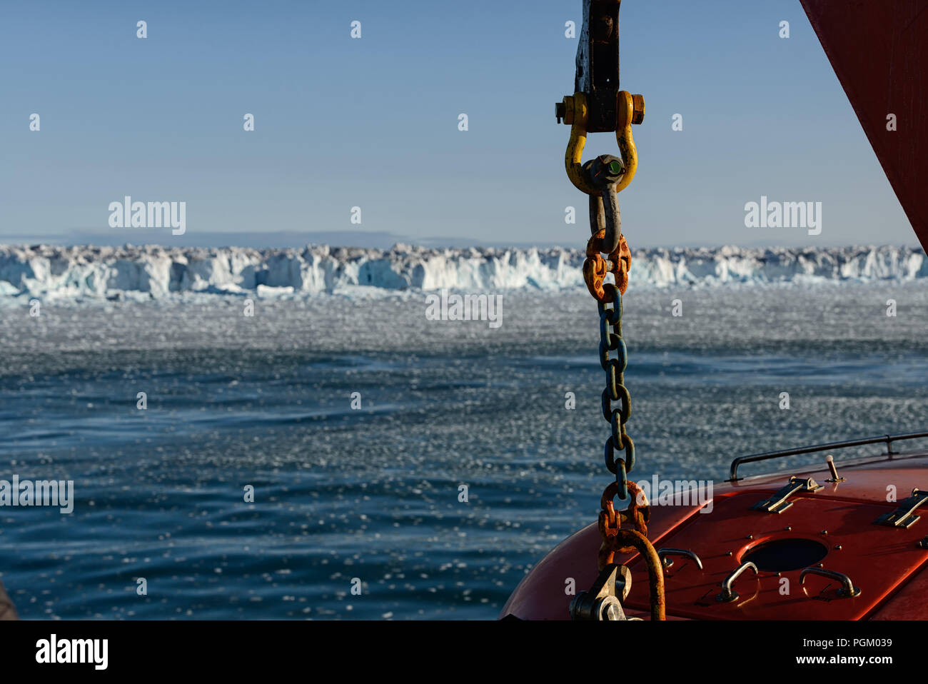 Chain and lifeboat of a cruiseship in front of the arctic ice cap Austfonna, Svalbard, Norway Stock Photo