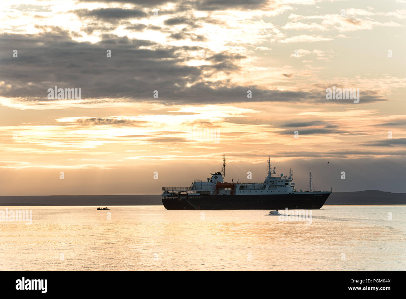 Cruiseship in the evening mood near Gråhuken, Andrée-Land, Svalbard Archipelago, Norway Stock Photo