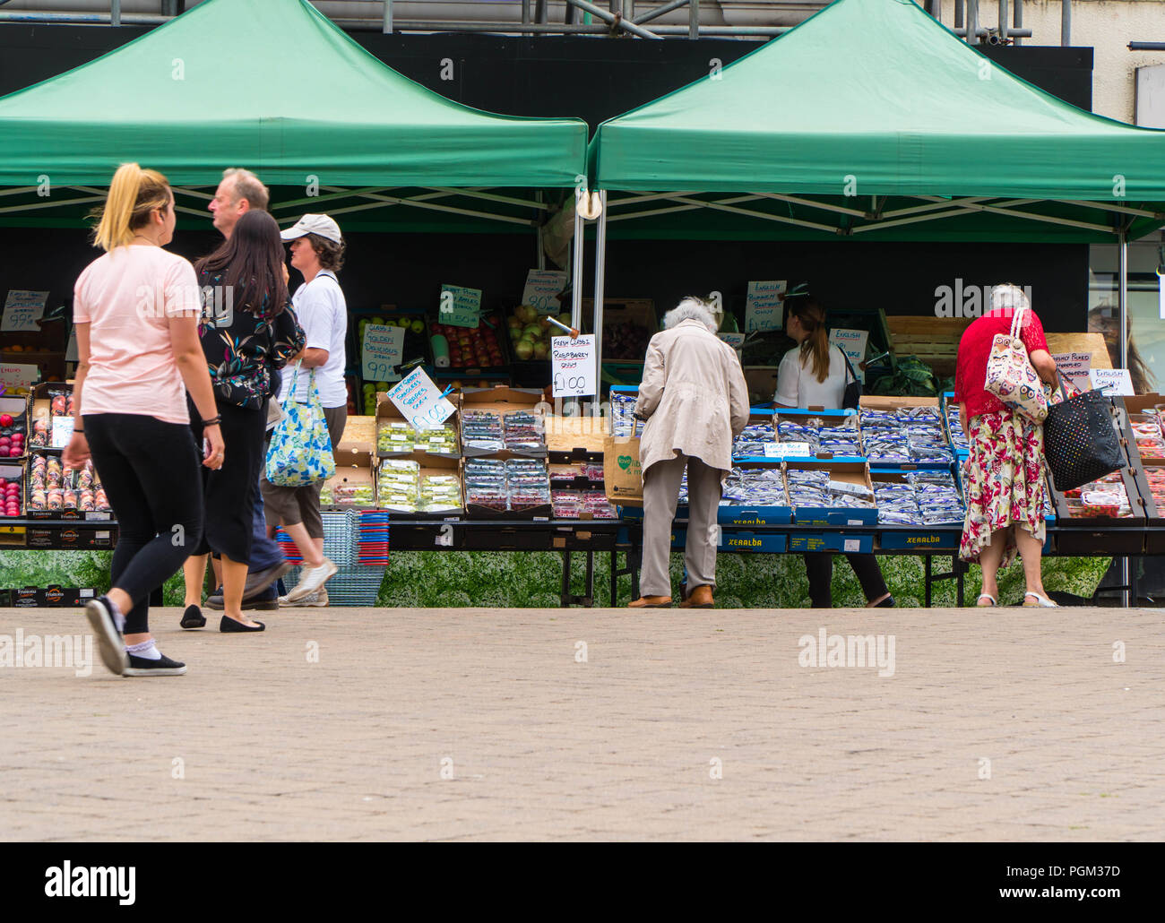Elderly ladies shopping at market stall, High Town Hereford UK. August 2018 Stock Photo