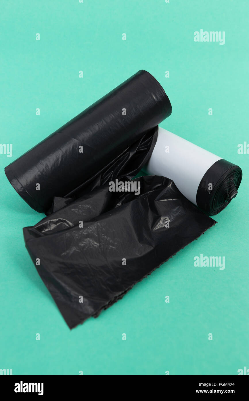 Black plastic garbage junk litter bag rolls as single use pollution
