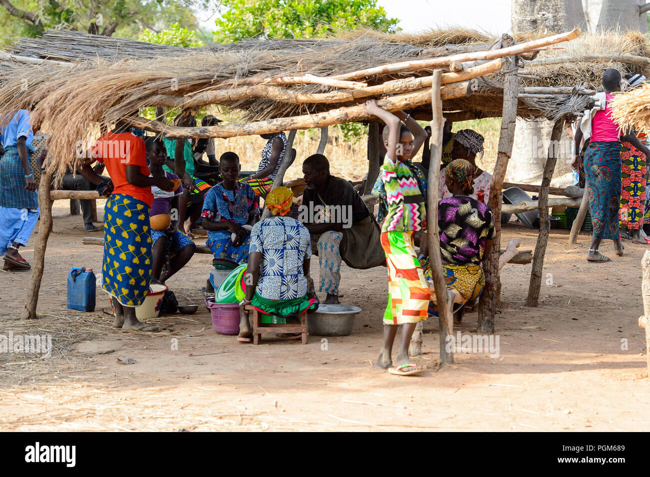KOUTAMMAKOU, TOGO JAN 13, 2017 Unidentified Togolese people sit in