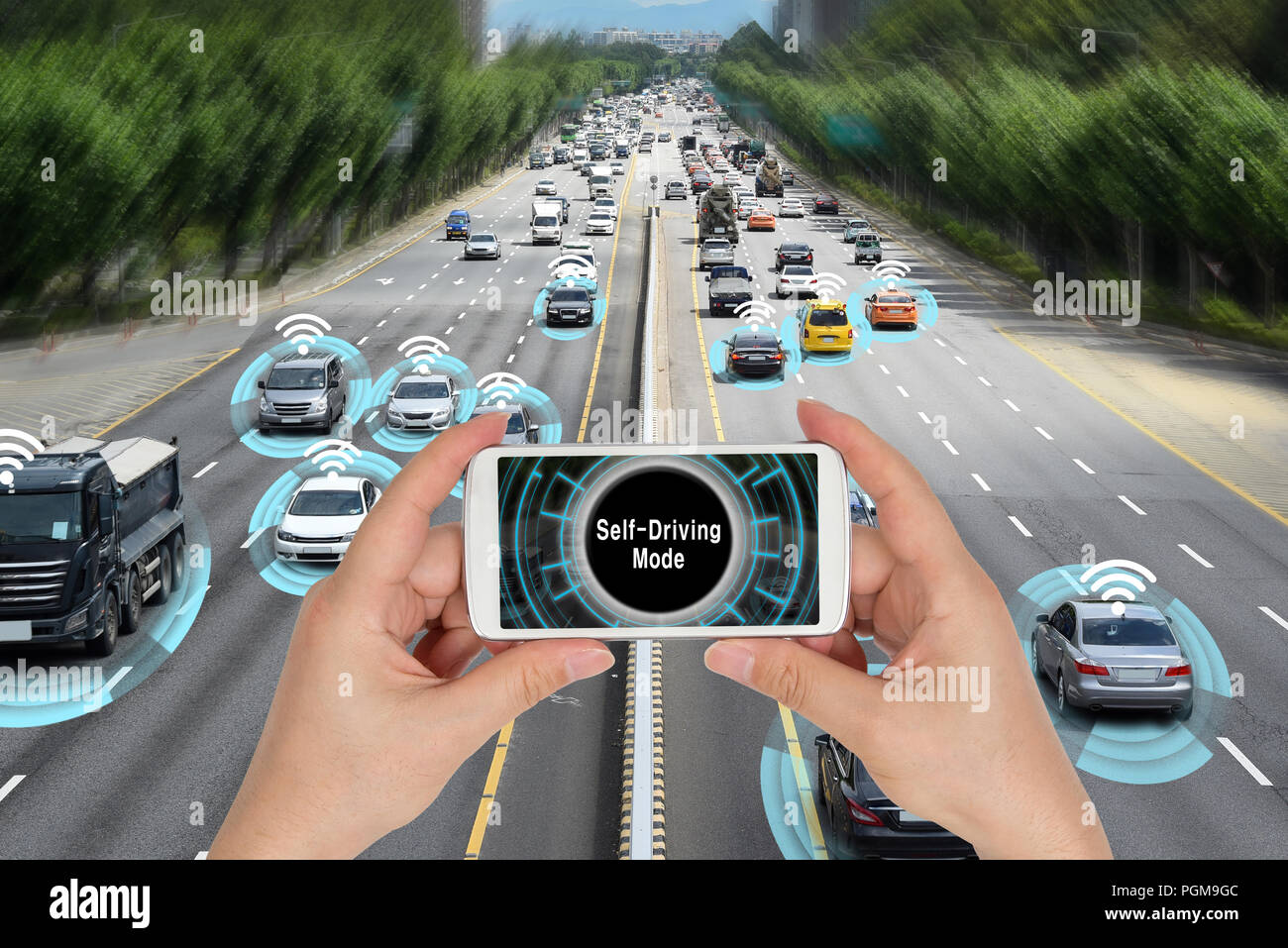 Automobile concept that connects with smart phone and autonomously drives the road. Stock Photo