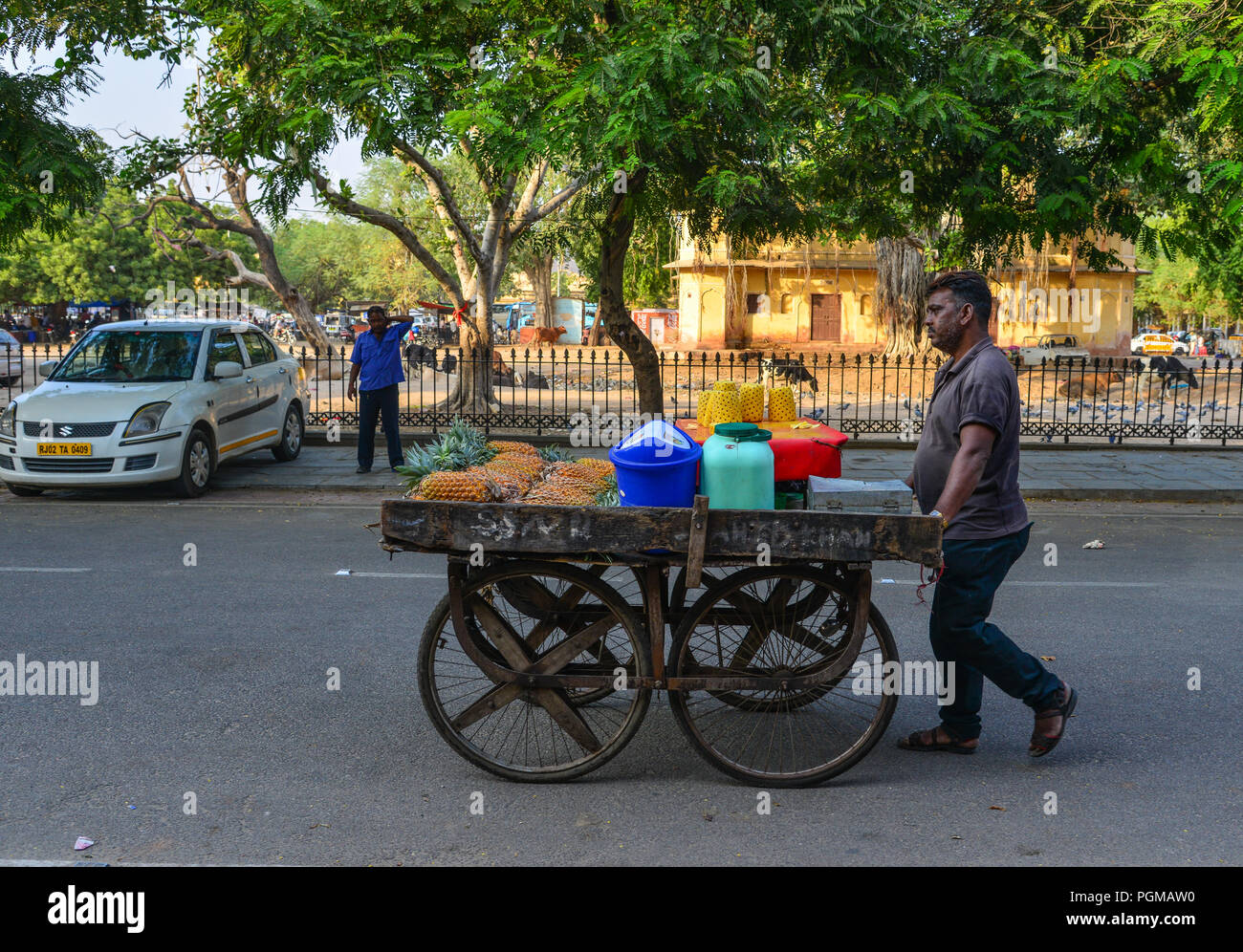 Jaipur, India Nov 3, 2017. A vendor on street in Jaipur, India. Auto rickshaws are used in