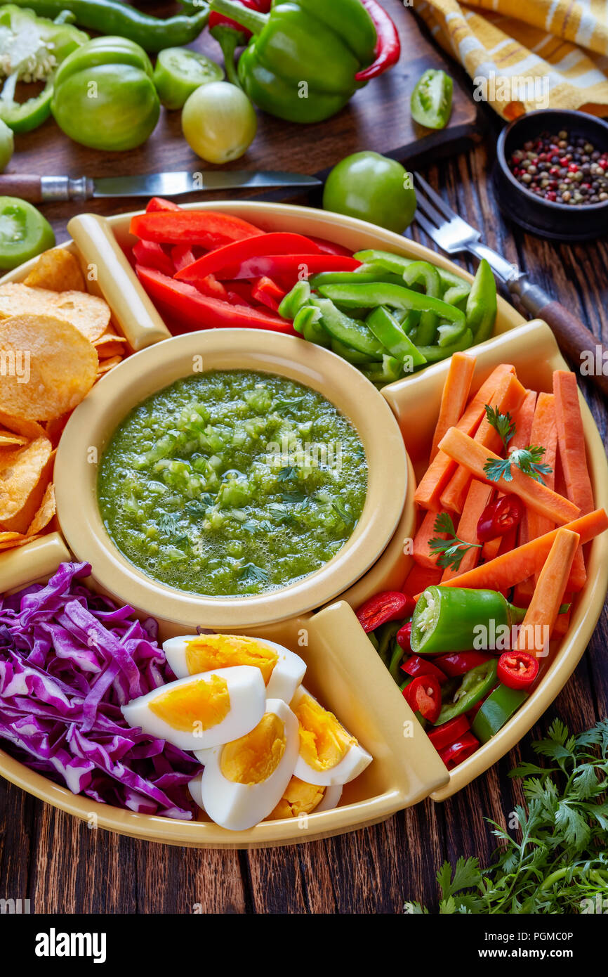 green salsa verde and mexican set of chopped fresh vegetables, hard