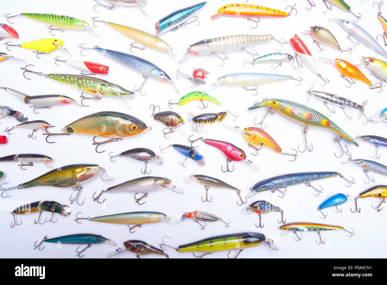 A selection of mostly modern fishing lures, also known as plugs, equipped with treble hooks and designed for catching predatory fish. Fishing plugs ar Stock Photo