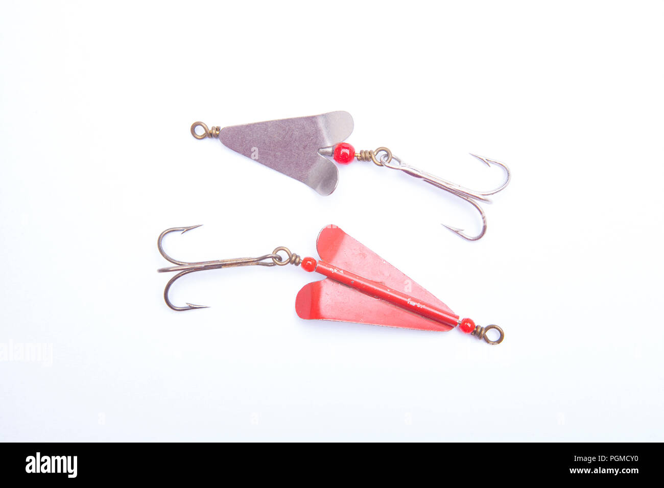 Two old metal spinners with treble hooks for catching predatory fish. From  a collection of vintage and modern fishing tackle. North Dorset England UK  Stock Photo - Alamy