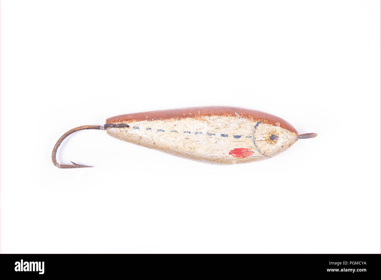 A homemade wooden fiishing lure designed for catching predatory fish. From a collection of vintage and modern fishing tackle. North Dorset England UK  Stock Photo