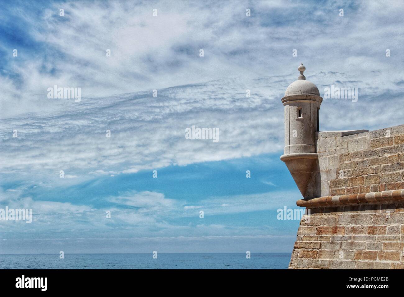 Watchtower of the fortress on the beach in Sesimbra village, Portugal ...
