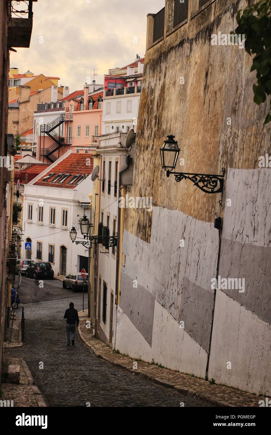 Old colorful houses and streets of Lisbon, Portugal in Spring. Majestic facades and old street lights. Stock Photo