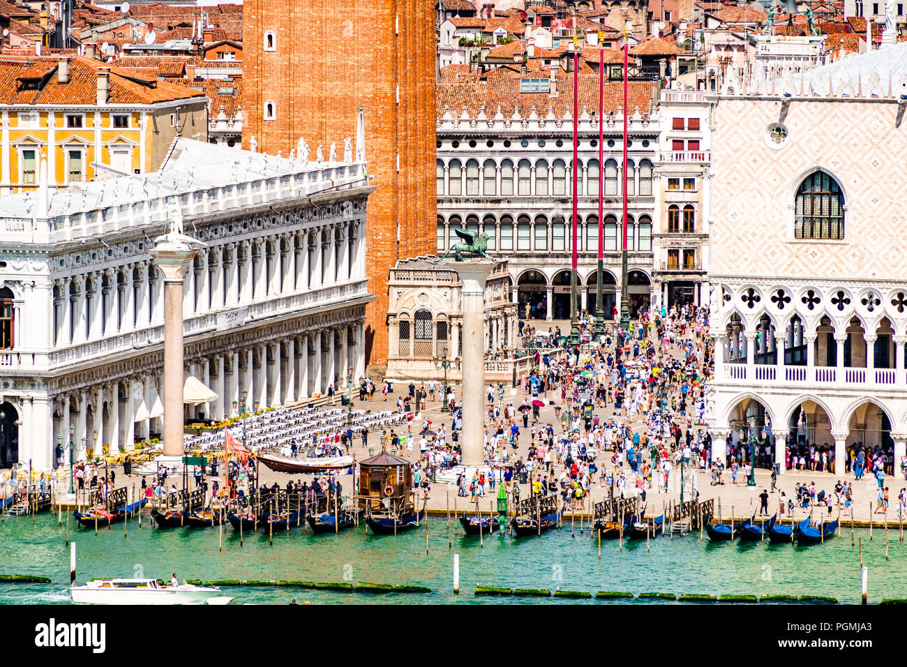 St Marks Square (Piazzetta di San Marco) opens onto the Grand Canal in Venice, Italy. In summer this area is filled with tourists. Stock Photo